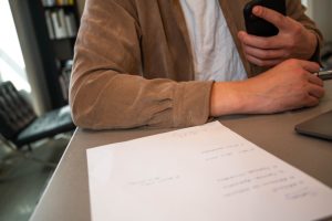 Blog on Bankruptcy 8 Person reviewing and signing legal papers for a durable power of attorney in Florida