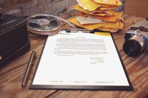 Blog on Bankruptcy 9 Person signing a revocable living trust document at a desk